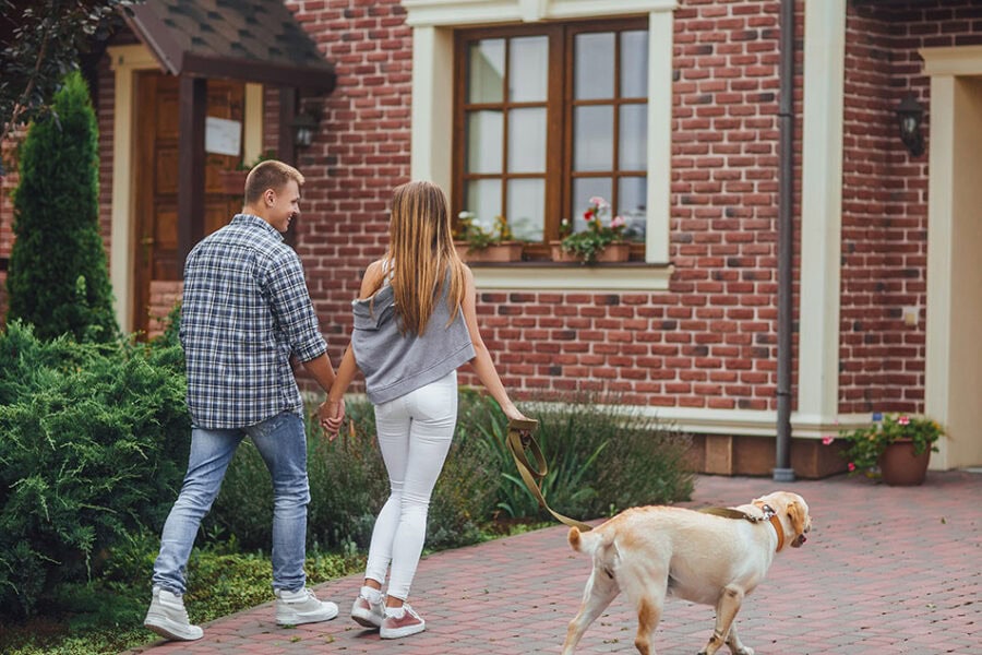 Blog Image Couple With Dog In Driveway