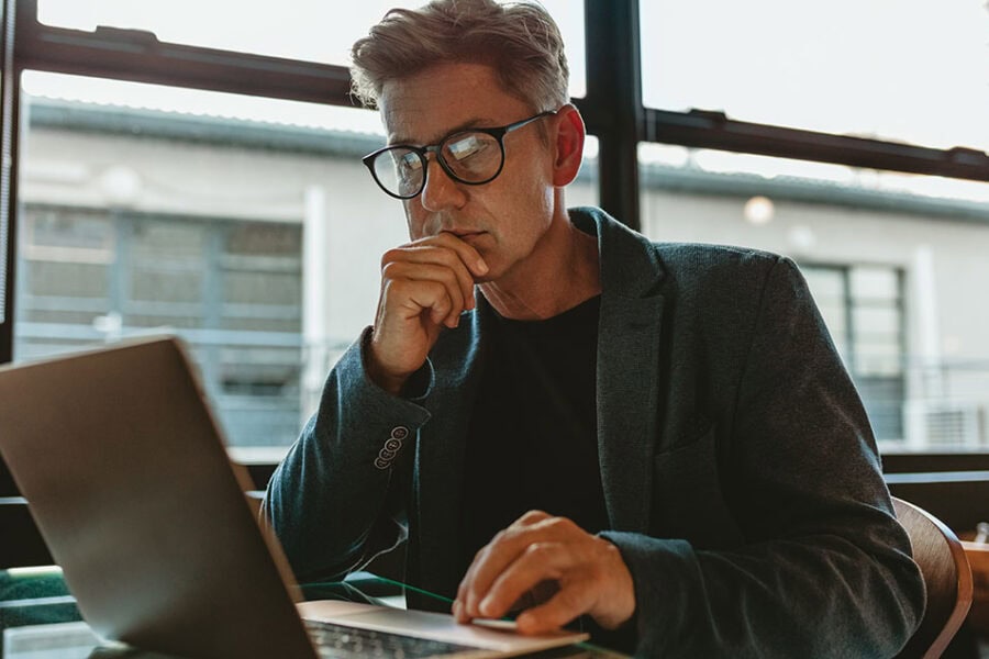 Blog Feature Image Man using laptop