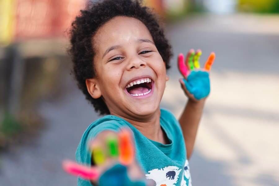 Child having fun at Curiosity Camps summer program at Martin Luther School in Joplin MO