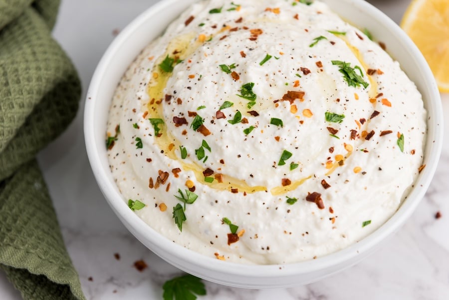 Try this creamy Whipped Feta Dip made with Greek yogurt, olive oil, garlic, and lemon. It's a crowd-pleasing, quick 5-minute appetizer!