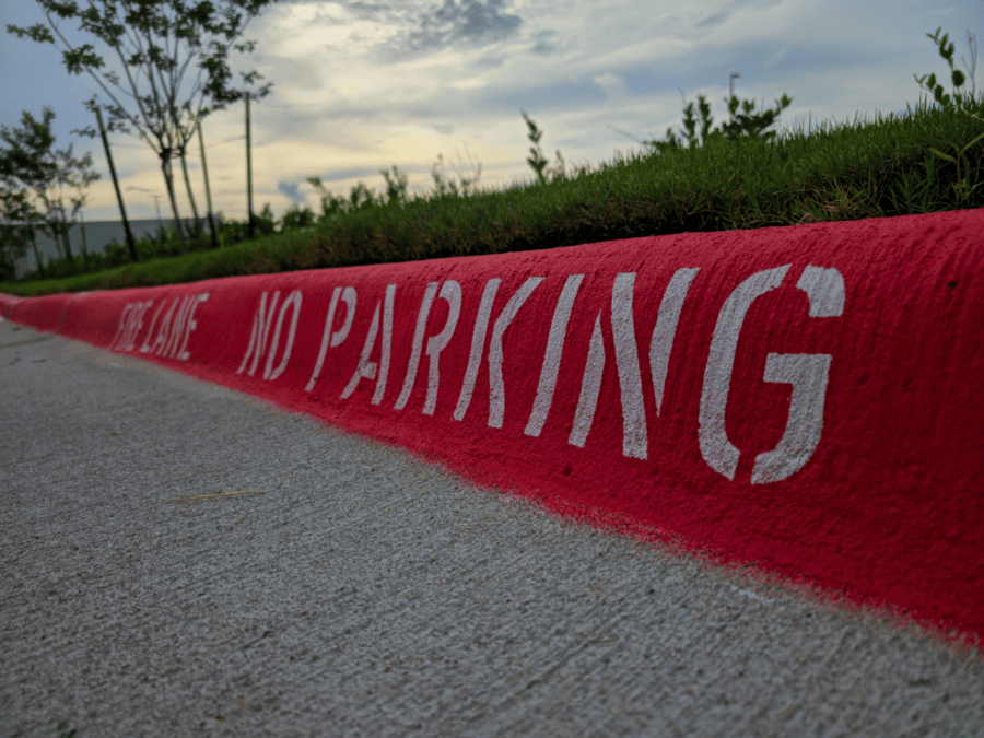 Commercial parking lot with fresh fire lane striping and access lane markings