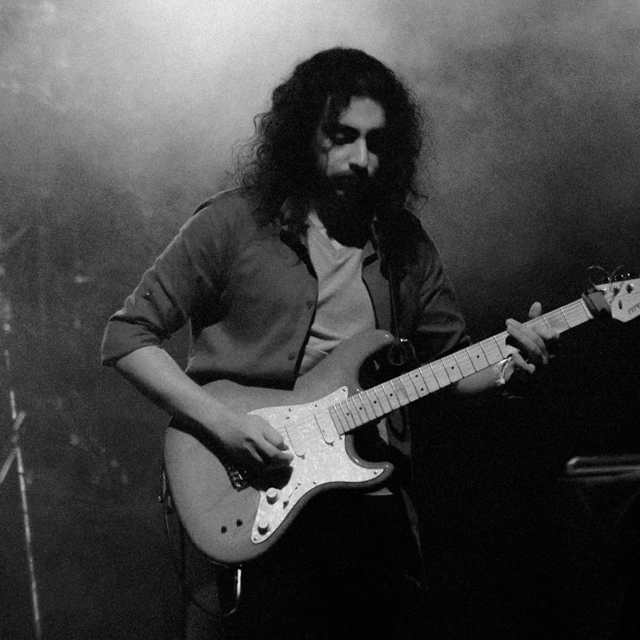 Dariush Meshkin playing electric guitar live