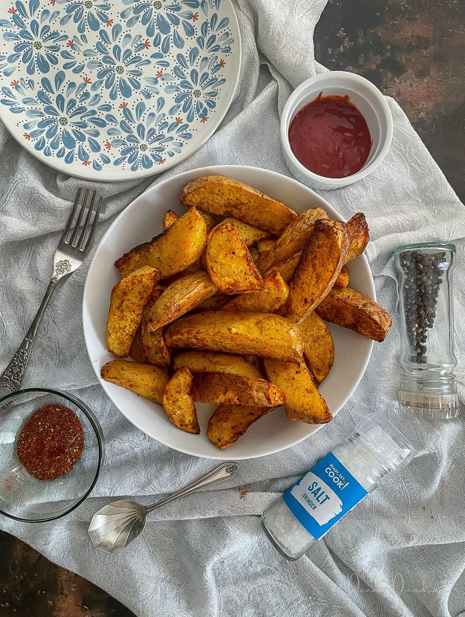 Air Fryer Fajita Potato Wedges in white bowl.