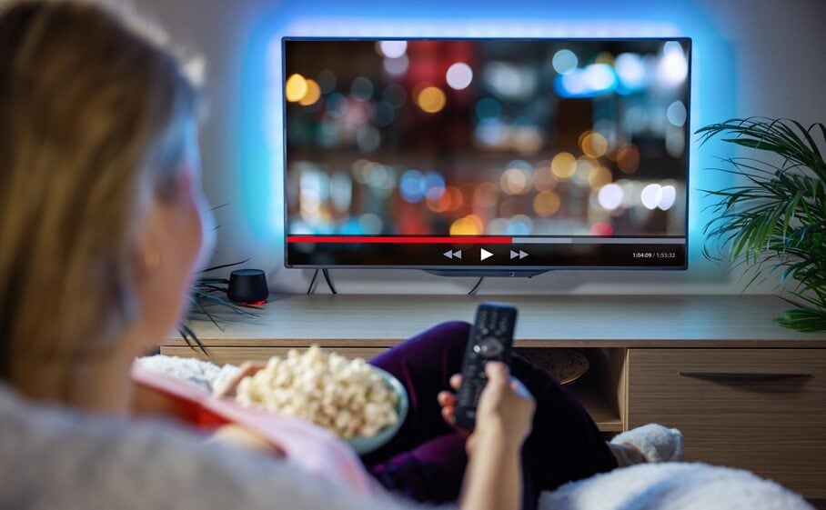 Woman relaxing and watching tv