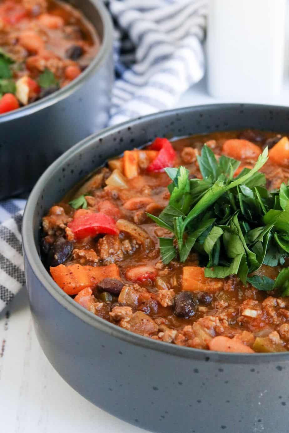 Pumpkin Chili is a delicious twist on the classic chili recipe. This easy chili recipe is made with pumpkin puree, ground beef, beans, and a simple homemade blend of chili seasonings.