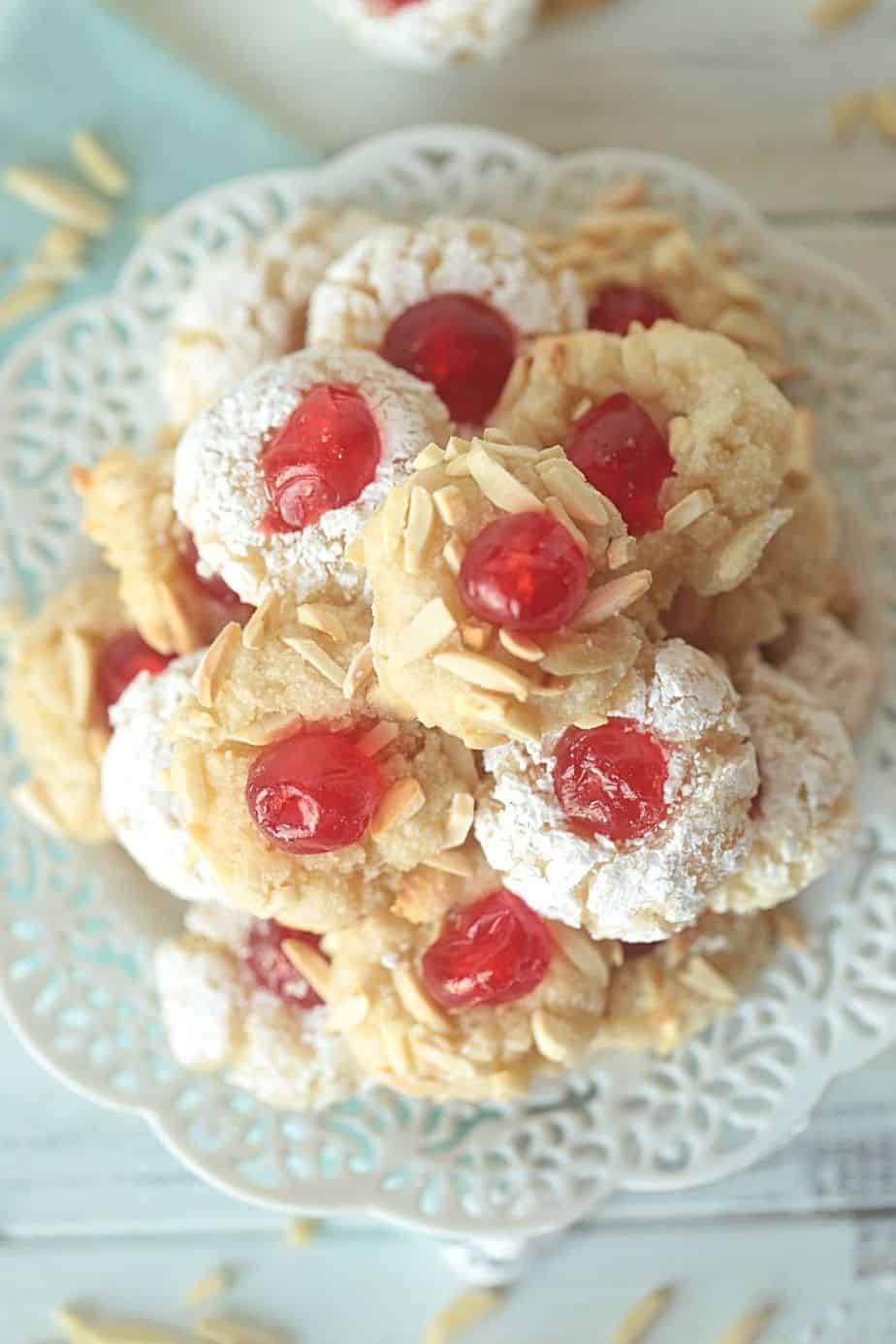 Get ready to prepare the tastiest Italian-style baked goods you’ve ever tried with this recipe for Italian Almond Cookies. Prepared with almond extract and other sweet ingredients, these cookies are full of flavor! These Italian Christmas Cookies are also great recipe to share at a Christmas Cookie Exchange. This easy cookie recipe is moist and full of almond flavor. Roll them in powdered sugar or slivered almonds and top with a candied cherry.