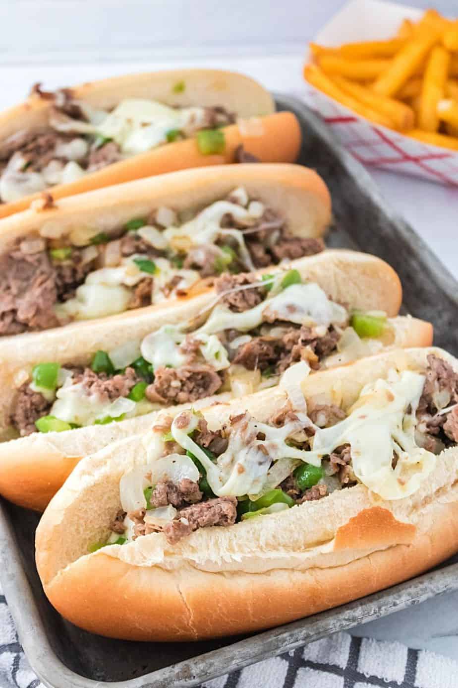 Enjoy the fresh flavor of a thinly sliced steak with cheese, onions, and peppers on rolls with this recipe for homemade Philly Cheesesteaks. If you’ve ever visited Philly (or any of the towns surrounding Philadelphia), you know that they are best known for the famous Philly Cheesesteak. This easy cheesesteak recipe is great to have for lunch and dinner. 