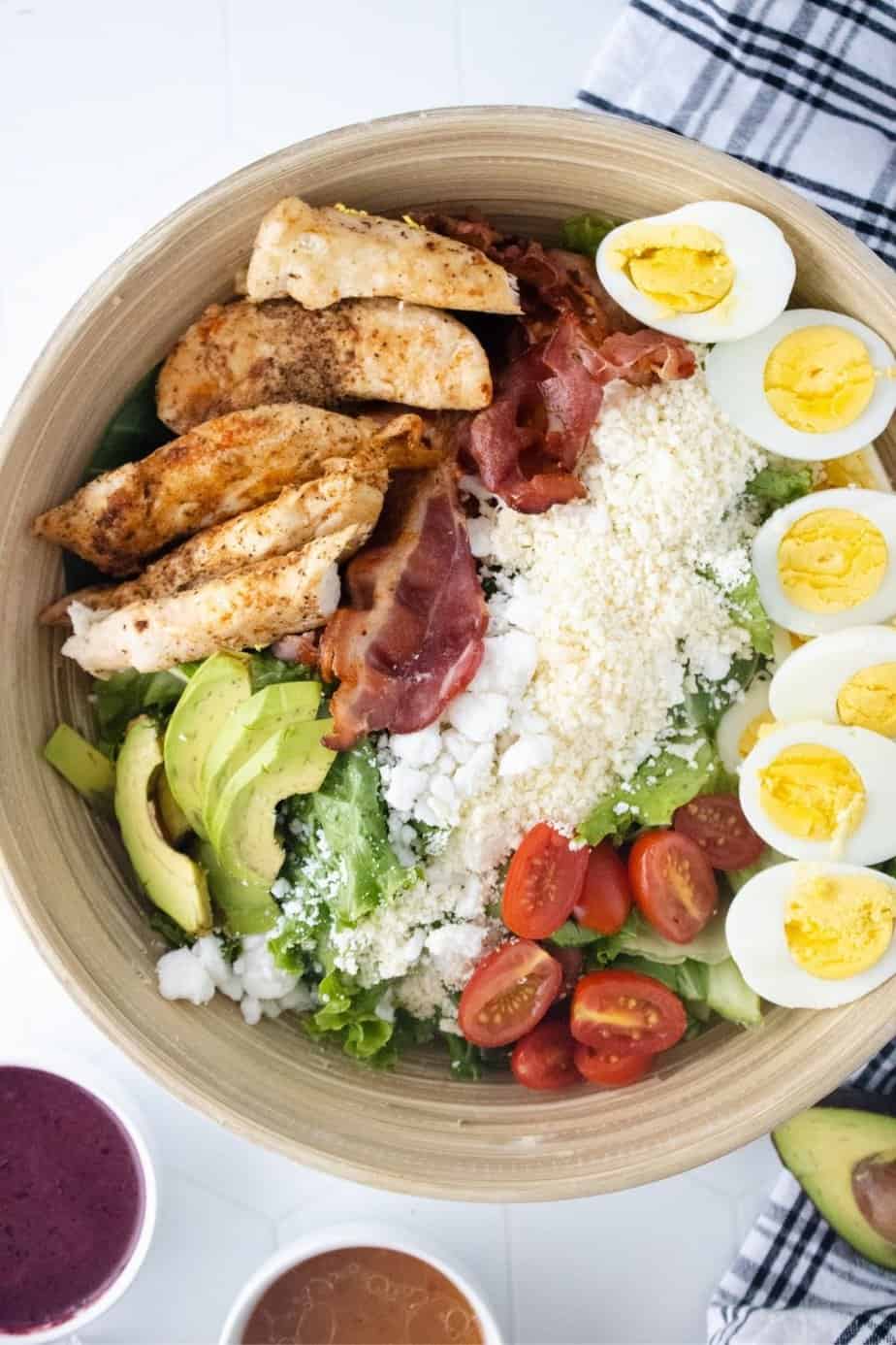 Delicious, light and flavorful is the way to go with this Grilled Chicken Cobb Salad recipe. This easy meal idea is great to take with you when you’re on the go, whether you’re headed to work or traveling. This salad is portable too! This is a great mason jar recipe to take to work or serve at a picnic. Summertime is the perfect time to enjoy salads. This Grilled Chicken Cobb Salad is delicious in so many ways, go ahead and give it a try!