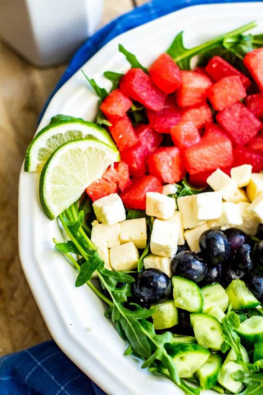 Watermelon Feta Arugula Salad is the perfect summer salad! The sweetness of the watermelon pairs perfectly with the salty feta, and the peppery arugula gives it a nice bite. If you're looking for a delicious summer salad, then this Watermelon Feta Arugula Salad is just what you've been looking for! It also makes a great patriotic recipe for your 4th of July party.