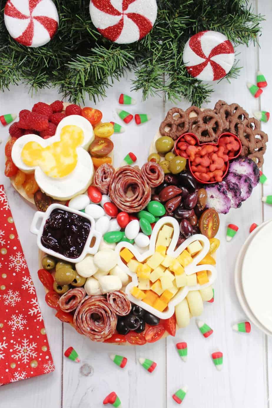 Oh Boy! The holidays are here and it's the perfect time to celebrate. Are you a Disney lover looking forward to celebrating with all of your pals? If so, make sure you make this festive Holiday Disney Charcuterie Board to enjoy this magical season!