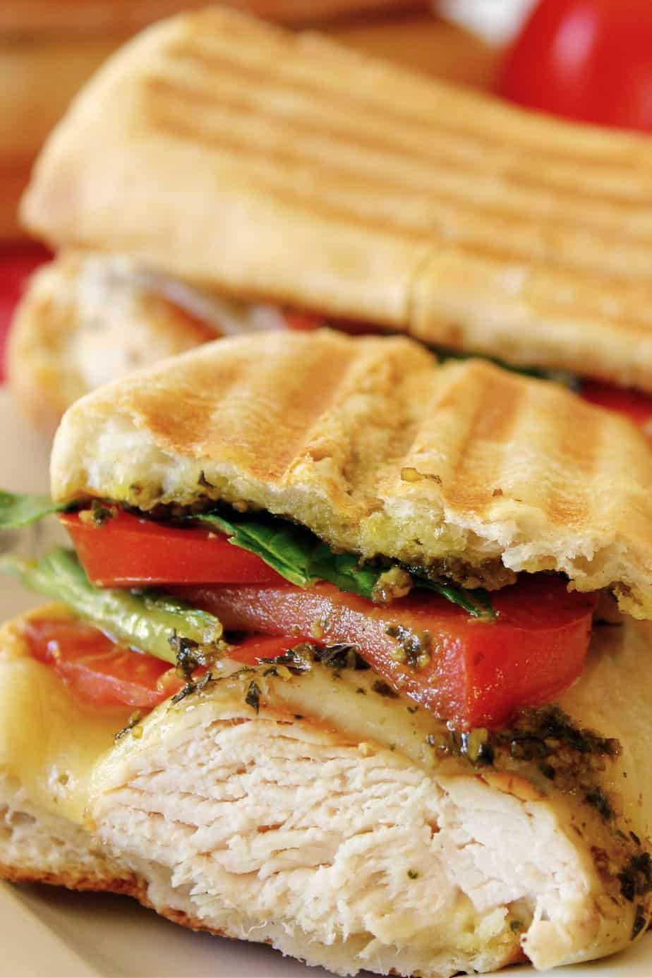 Skip the traditional ham and cheese and make a more fulfilling meal with these Pesto Chicken Sandwiches. Made with chicken, cheese, and tomatoes, you will love the taste of this flavorful sandwich.