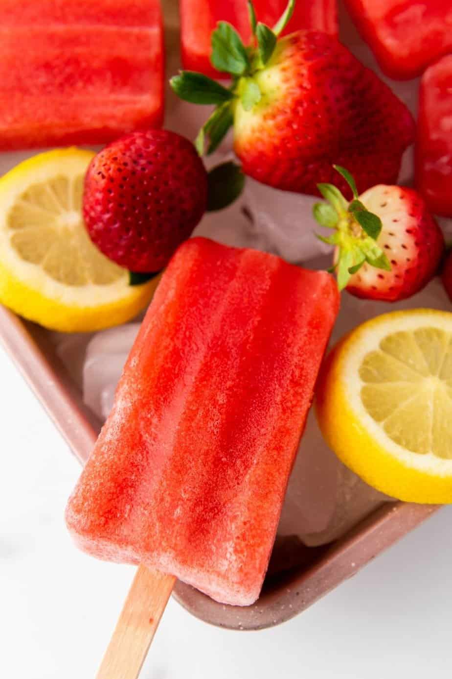 Cool down on a warm summer day with these refreshingly delicious Strawberry Lemon Popsicles. They’re fruity, flavorful, and naturally good for you. This easy popsicle recipe is a great treat for kids and adults.