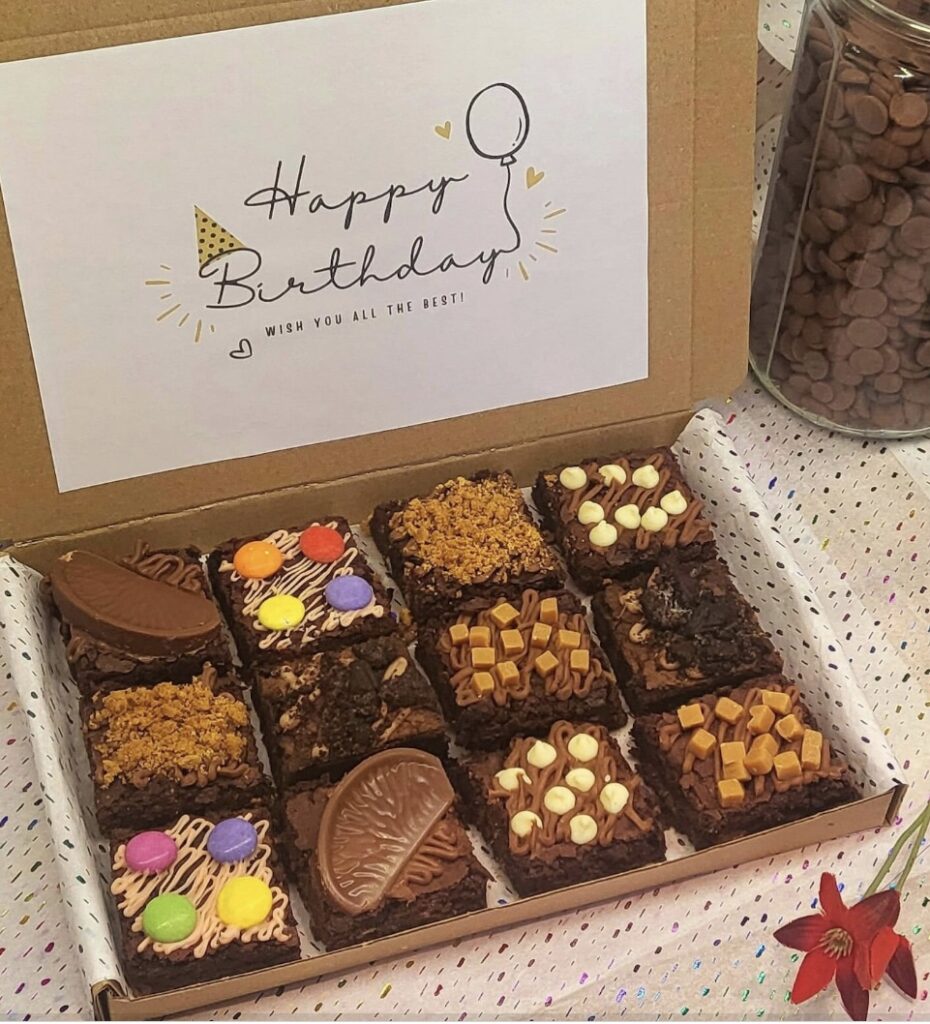 Chocolate brownie decoration with nuts, caramel fudge, chocolate sprinkles and more