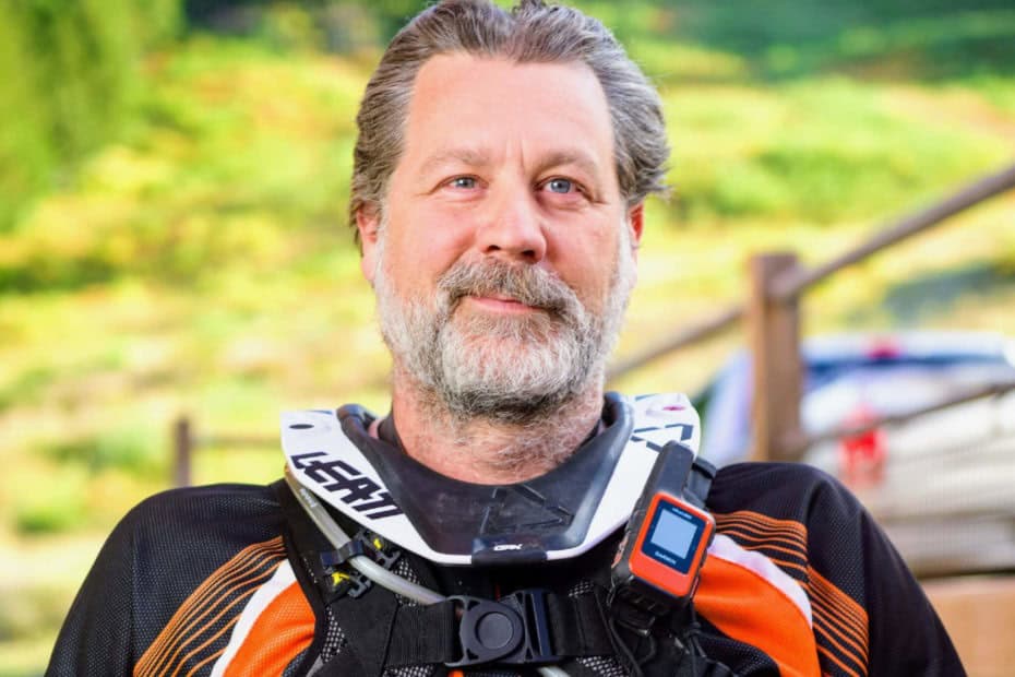motorcycle rider with neck brace and Garmin inreach