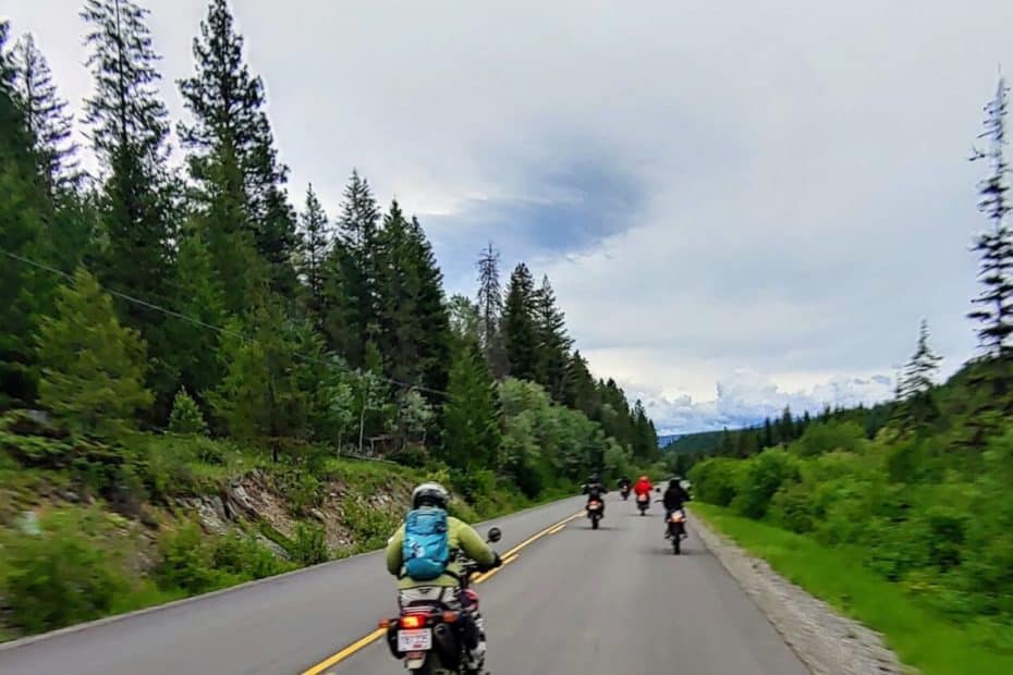 group of dual sport motorcycle riders on road