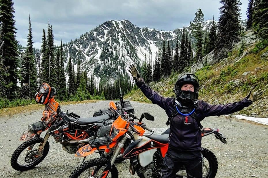 motorcycle rider and motorbikes at summit of Gray Creek Pass
