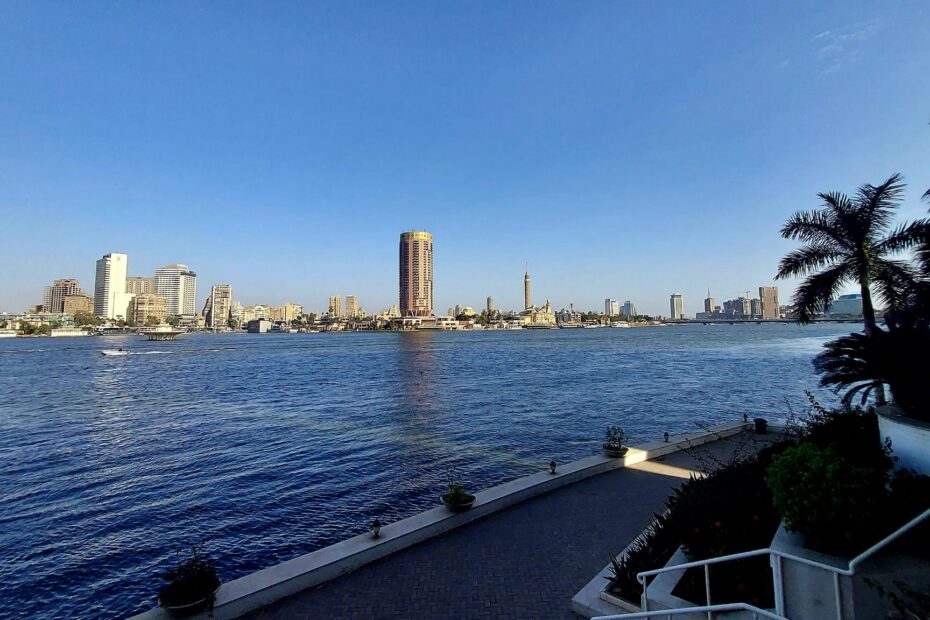 8 Days 7 Night Private Package Tours,Cairo cityscape,with landmarks like the Nile River and the Pyramids.