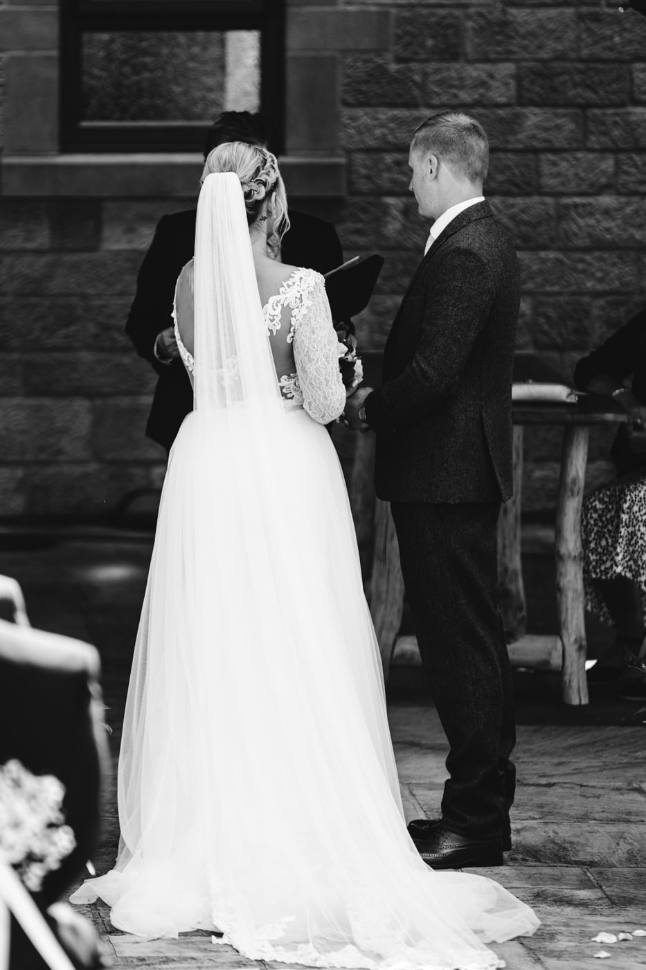 an outdoor ceremony with the bride walking down the aisle to get married at heaton house farm