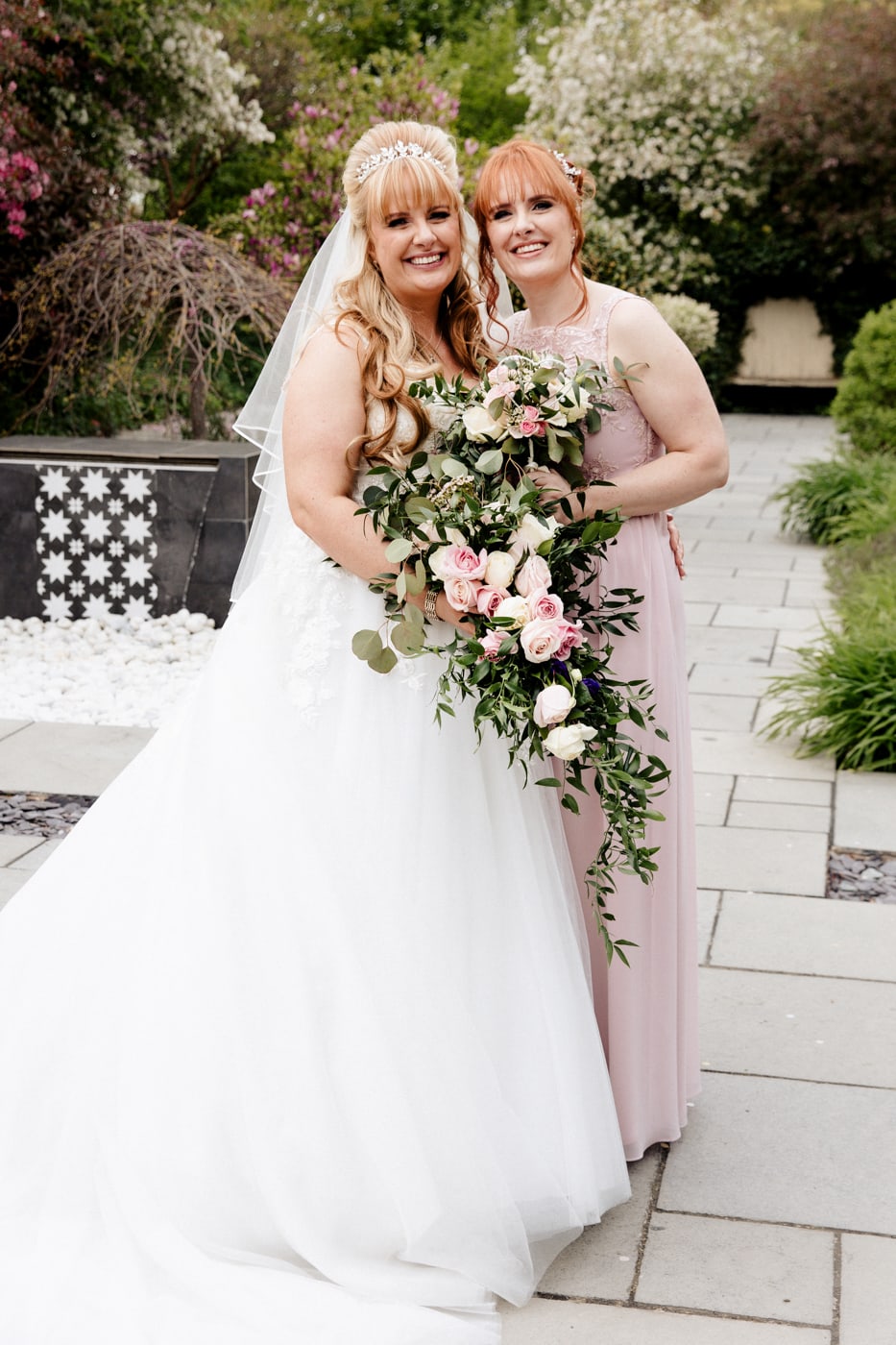 styal lodge cheshire barn wedding venue group photos on the patio