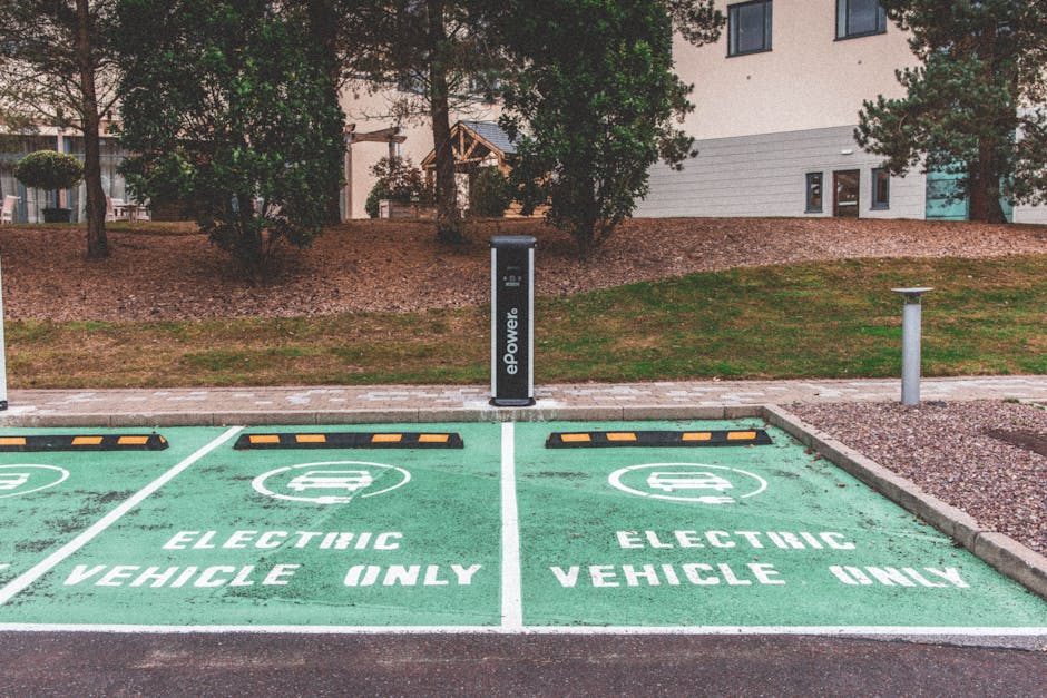 Green electric vehicle parking with charging stati