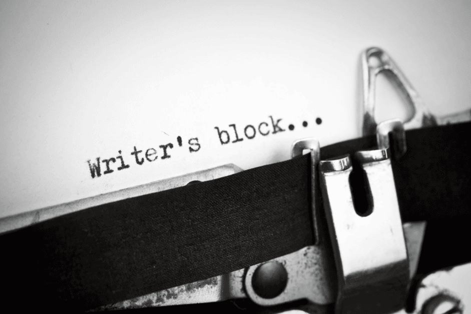 The words writer's block typed on a piece of paper on a typewriter