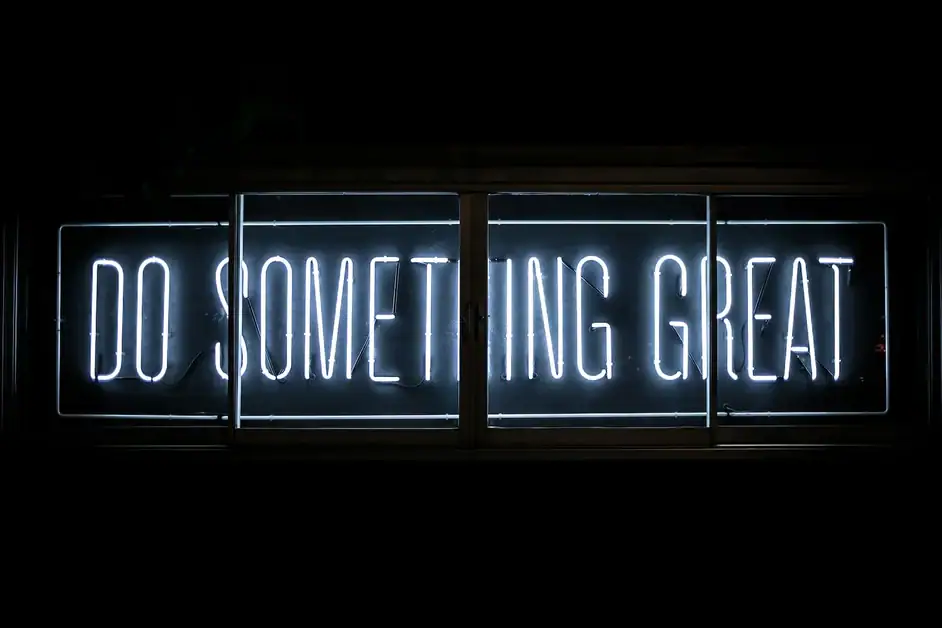 A neon sign that says do something great