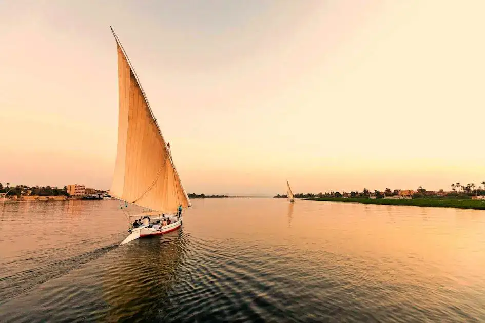 Traditional felucca sailing on the Nile during a Luxor tour