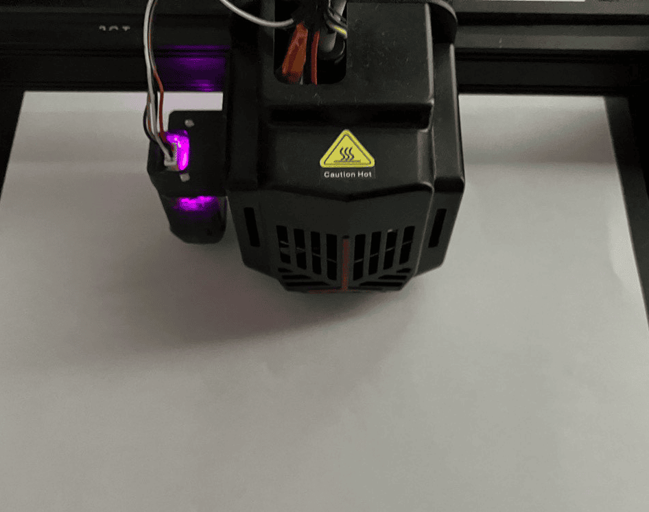 printhead positioned close to the bed with a piece of paper in between