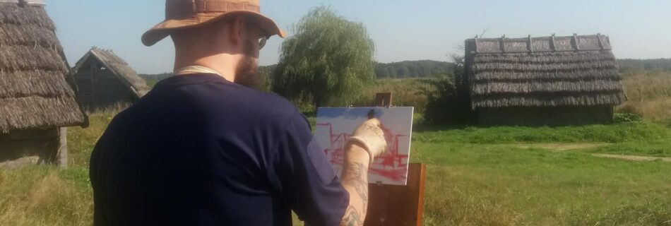 Andrea Bocedi using a Jack Richeson Sienna All-in-One Pochade Box for plein air painting in Poland