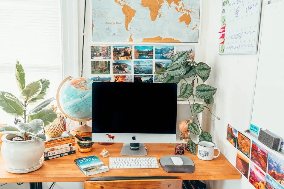 This is my home office! It's filled with travel things, from postcards to globes to smaller globes to travel-themed cups to a big scratch-off map. Yes: I literally wrote a gift guide for myself and then bought everything on it.