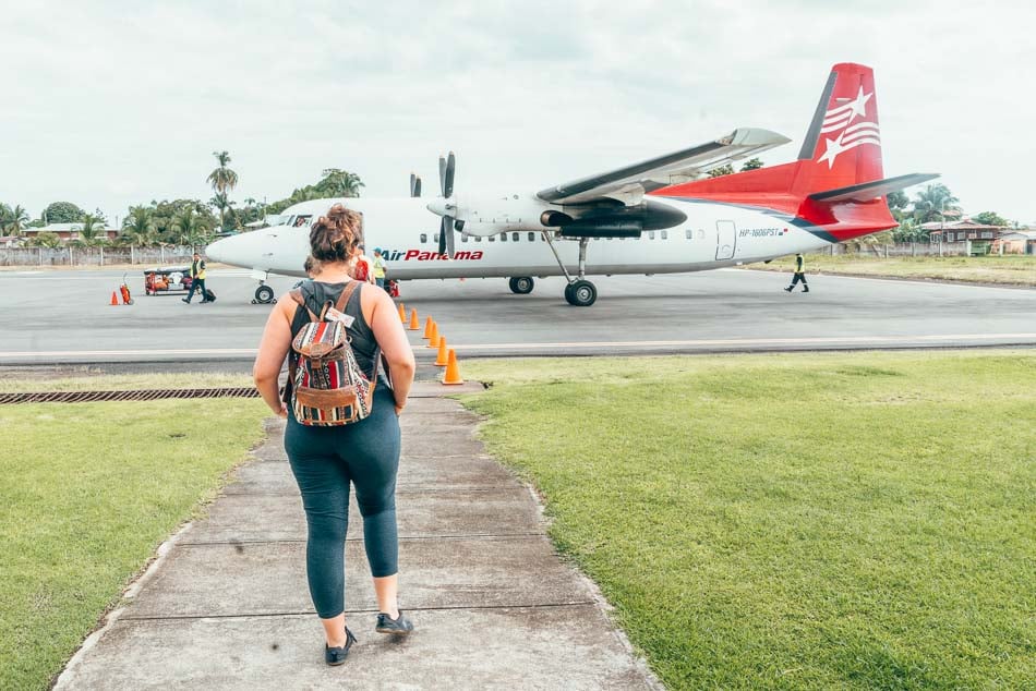 Lia walking up to an Air Panama plane.