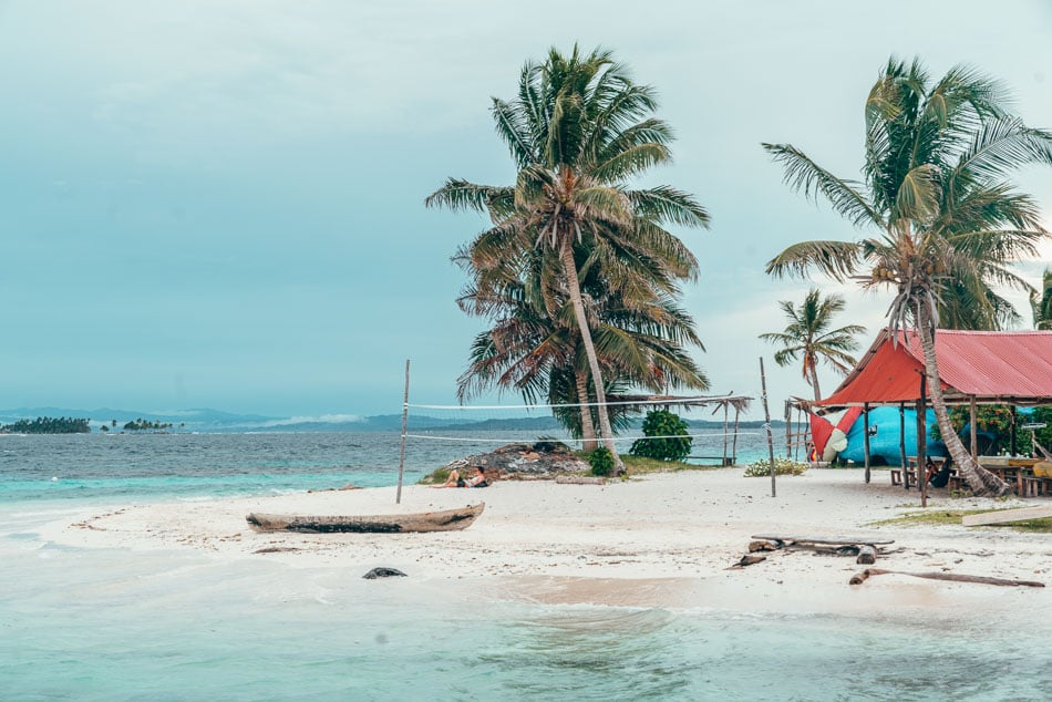 Boat and volleyball net on the beach in the San Blas Islands aka Guna Yala, Panama.