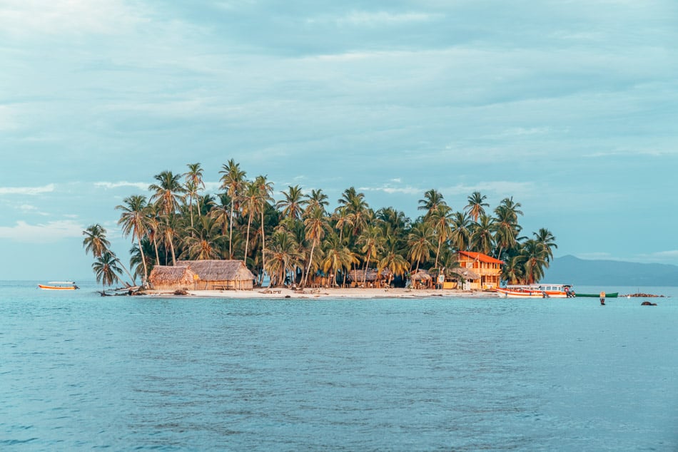 Island floating in the Caribbean in the San Blas Islands, Panama at golden hour.