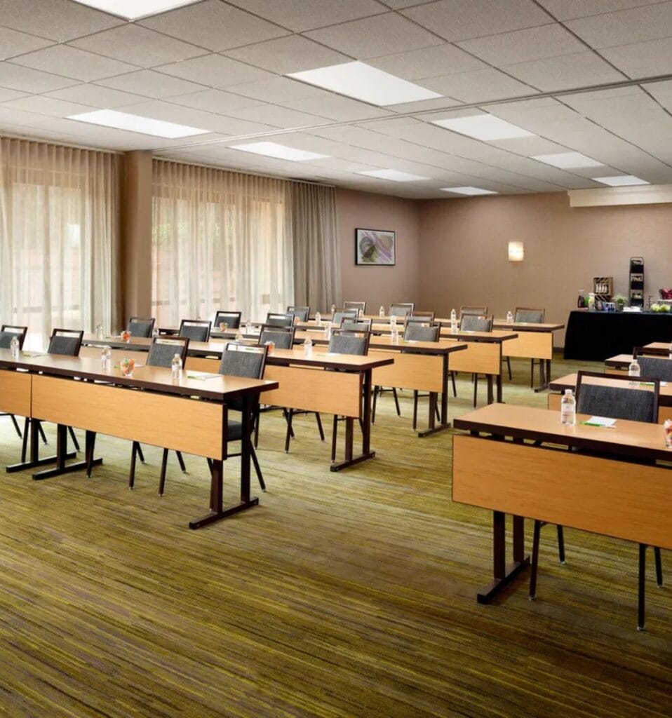A hospitality renovation creates space for a modern conference room filled with desks