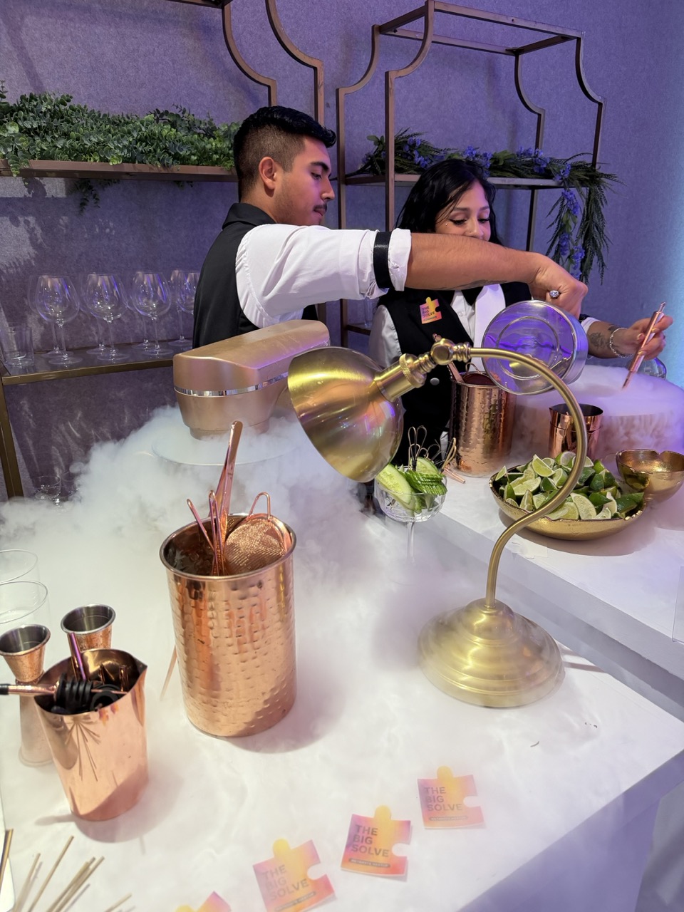 Professional Houston bartender crafting a cocktail at an event