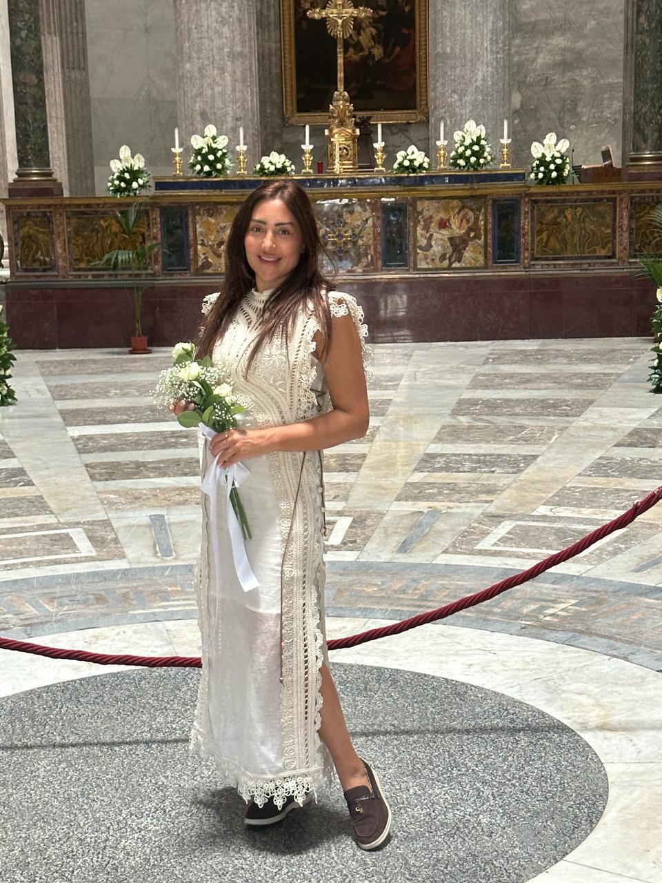 Portrait of Özge Taşker Falyalı at a church event