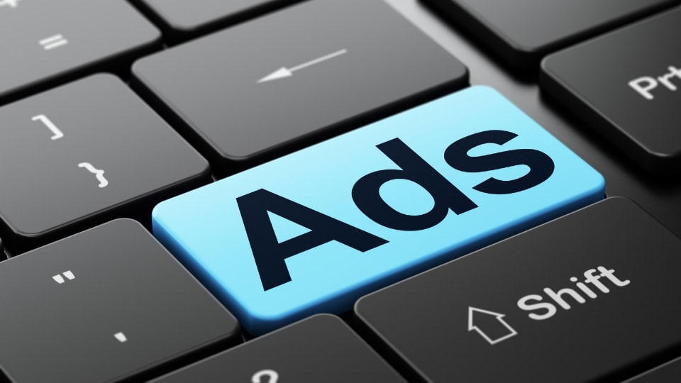 The word ads written on a piece of paper