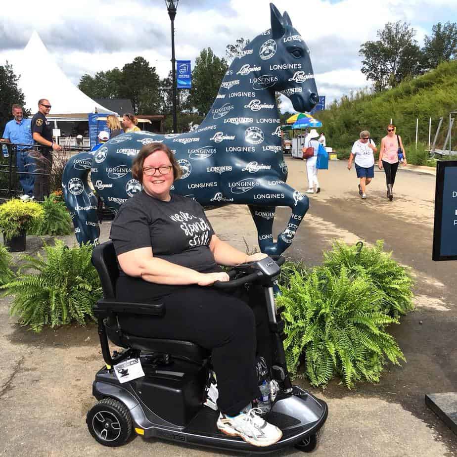 Mary and her scooter at the FEI World Equestrian Games