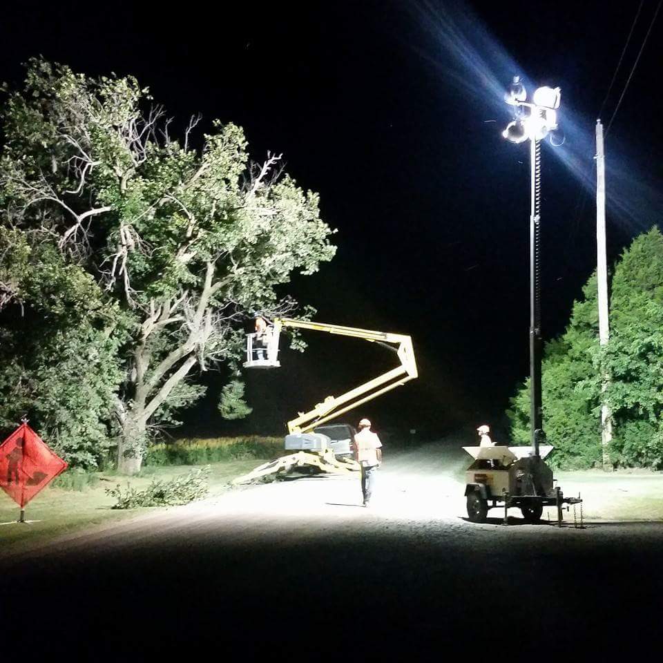 nighttime tree trimming done by Wichita tree service llc employees.