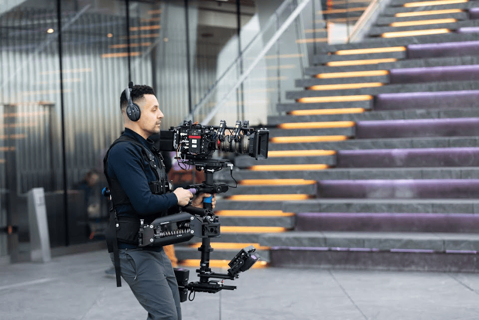 An image of a cameraman filming a video
