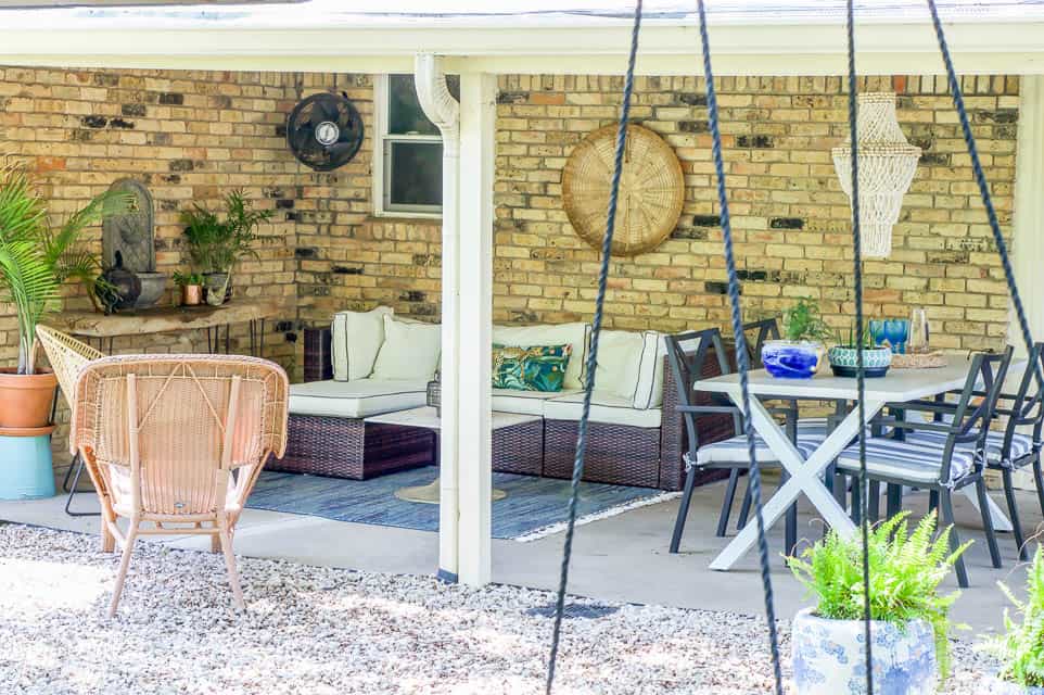 living spaces outdoor with a seating area and dining area on back porch.