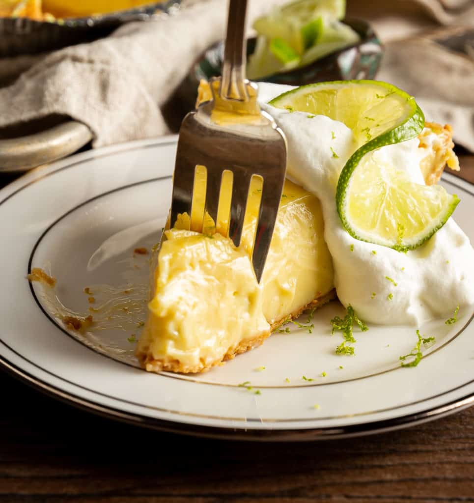 piece of key lime pie with fork in it