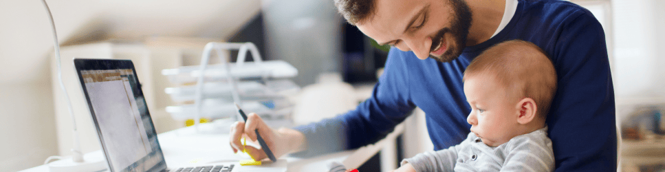 Image of a dad working with their child