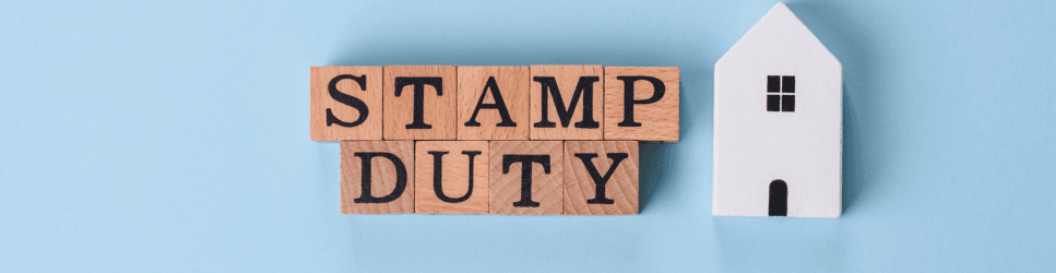 Image of blocks spelling "Stamp Duty" and a Home