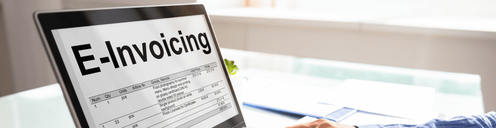 Image of a laptop with e-invoicing on screen