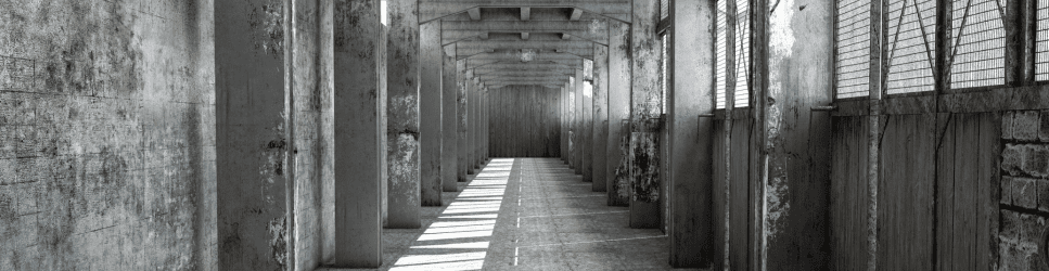 Image of a dilapidated warehouse for article header.