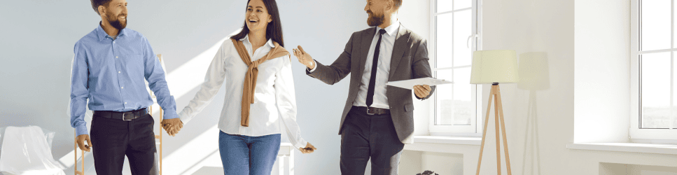 Image of a couple viewing a newly built property for article web header
