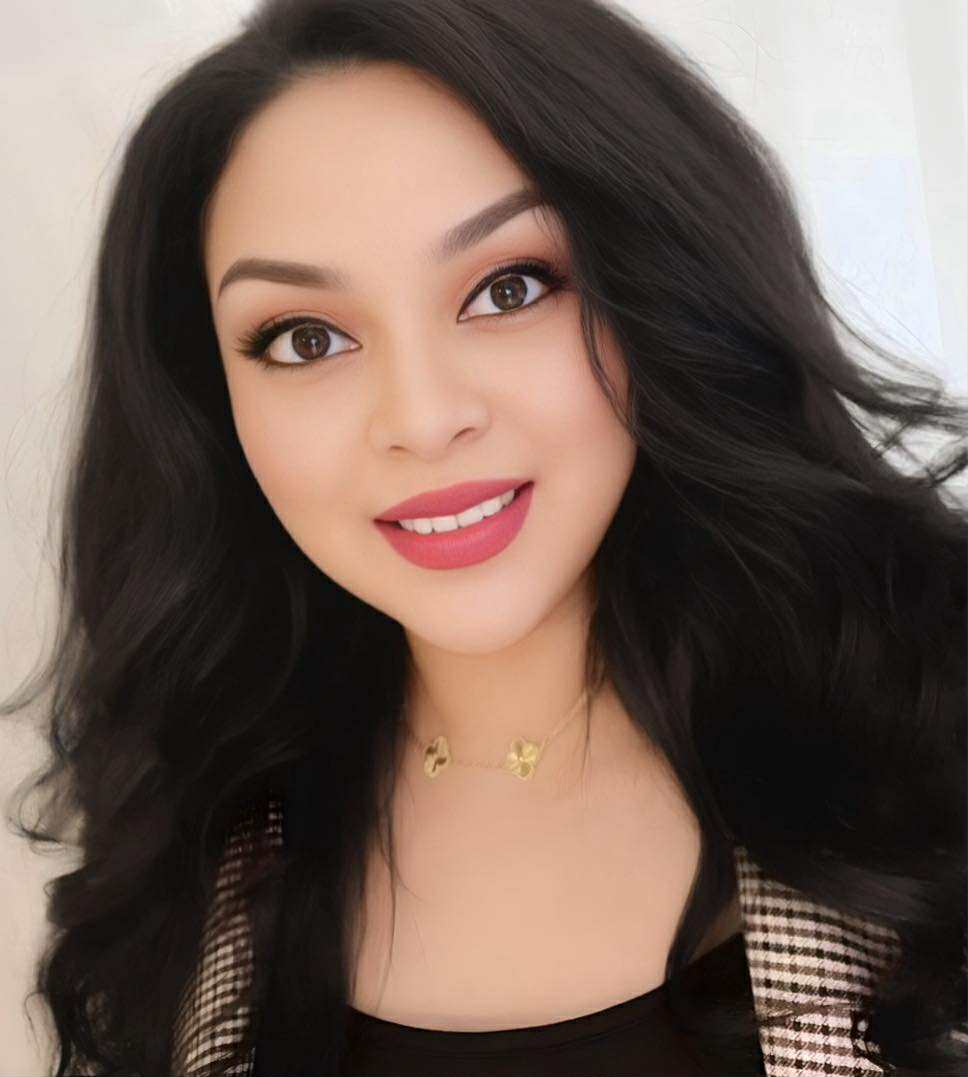Headshot of Ashley Aileen Mendoza, smiling, wearing a professional top, with a neutral background. Ashley is a CCHM graduate, founder of Rose Blanche Wellness, and host of the Petals & Potencies podcast.