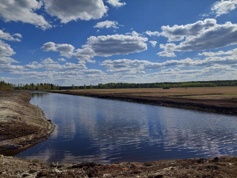 Water storage reservoir next to the field.