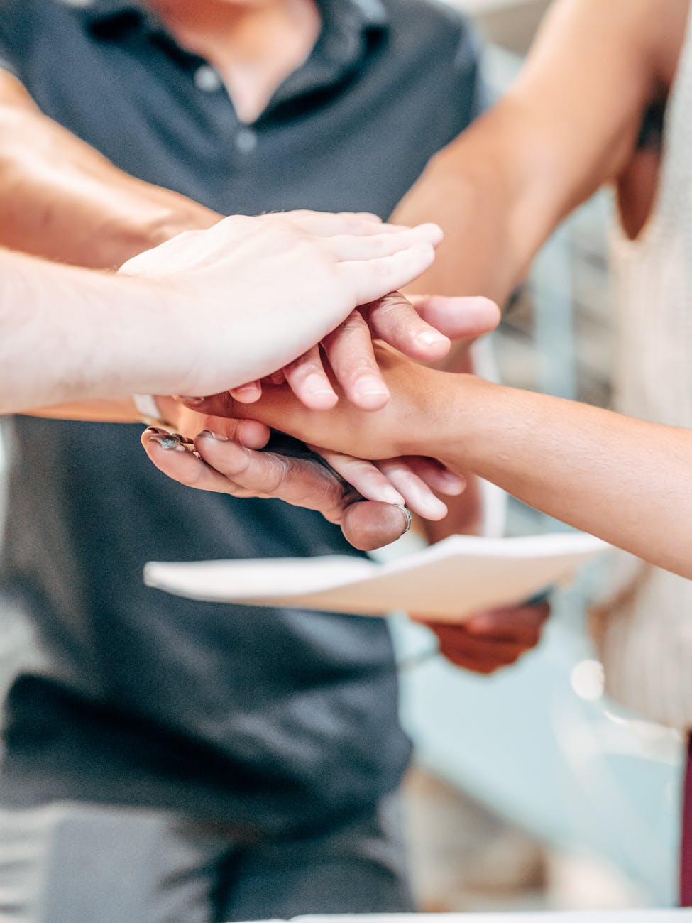 people putting hands together